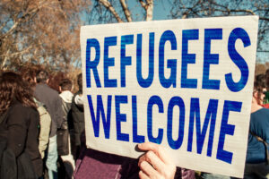 sign that reads refugees welcome